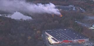 Brush fire burning near Home Depot, apartment complex on Route 1 in Saugus