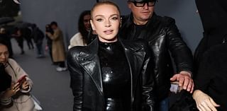 Lindsay Lohan poses up a storm in a black sequin dress at Balenciaga show during Paris Fashion Week