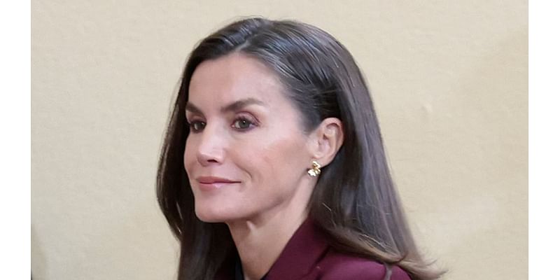 Suits you! Queen Letizia of Spain dons chic burgundy ensemble she greets Olympians and Paralympians alongside King Felipe