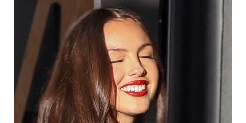 Olivia Rodrigo turns up the heat in a white mini dress as she greets fans in Sydney ahead of her sold-out show