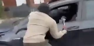 Moment thugs carried out brutal targeted hammer attack on car on the school run as pupils look on in horror