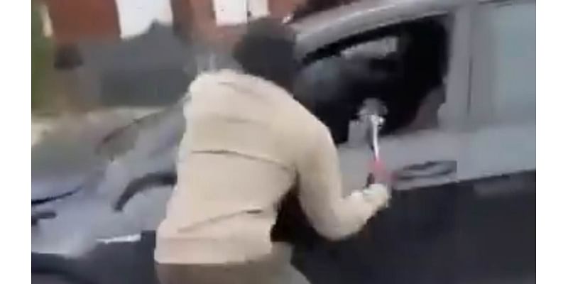 Moment thugs carried out brutal targeted hammer attack on car on the school run as pupils look on in horror