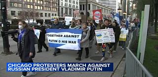 Protesters march along Michigan Avenue to oppose Russia's war in Ukraine