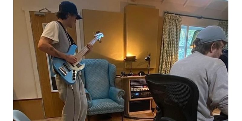 Is Cruz Beckham's girlfriend Jackie Apostel, 29, helping to launch his music career? Brazilian singer shares candid snap of her boyfriend, 19, playing guitar in the studio