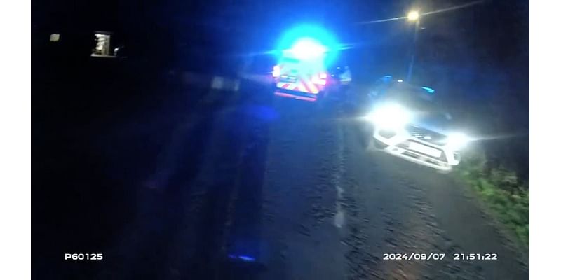 Moment driver brazenly admits 'I'm drunk' to police officer after flipping his car and leaving it in the middle of the road