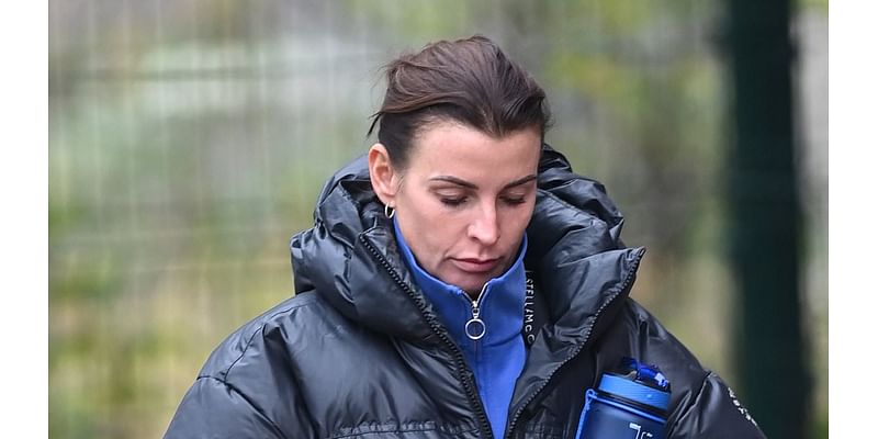 Coleen Rooney wraps up in a padded coat for a gym session after it was revealed she could be excluded from I'm A Celebrity trials