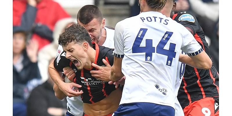 Preston forward Milutin Osmajic appears to BITE Blackburn's Owen Beck on the neck in shocking scenes in Lancashire derby