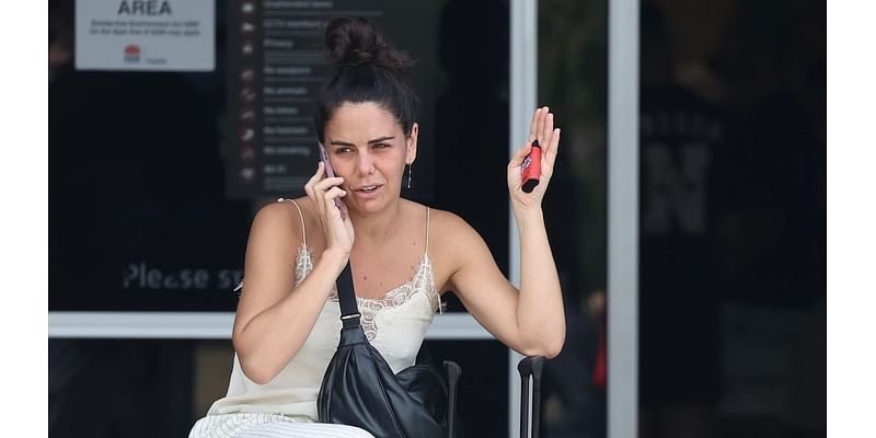 Makeup free Home and Away favourite Emily Weir sucks on a vape as she returns to Sydney after spending time in the US