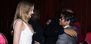 Angelina Jolie looks on proudly as her close friend Akala embraces her son Pax at Maria premiere - after actress sparked romance rumours with the British rapper