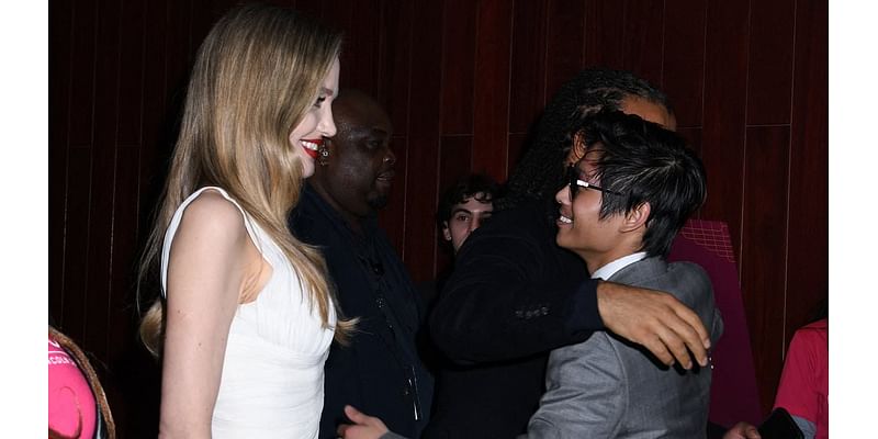 Angelina Jolie looks on proudly as her close friend Akala embraces her son Pax at Maria premiere - after actress sparked romance rumours with the British rapper