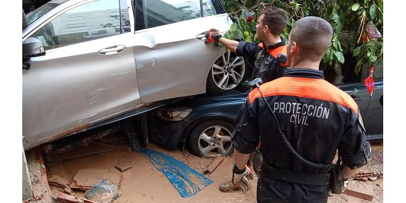 Valencia flood miracle as woman is found alive after being trapped with her dead sister-in-law for THREE days in their car - as rescue teams continue grim hunt for victims of deadly mega storm