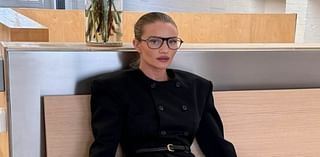 Rosie Huntington-Whiteley shows off her supermodel legs in fishnet tights and stilettos as she channels office chic in seductive shoot