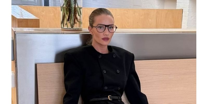 Rosie Huntington-Whiteley shows off her supermodel legs in fishnet tights and stilettos as she channels office chic in seductive shoot