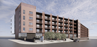 This Crossroads parking lot will soon house apartments with affordable units, rooftop deck