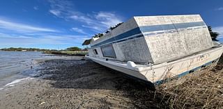 Another derelict boat in Elizabeth River awaits removal