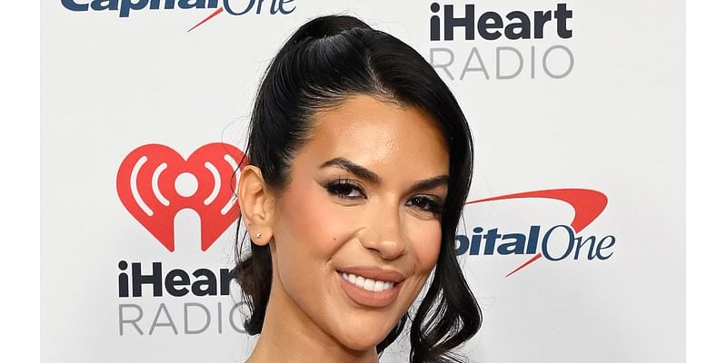 Ekin-Su Culculoglu puts on a busty display in a flirty pink corset dress as she attends the iHeartRadio Festival in Las Vegas