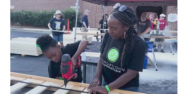 Georgia's Own Credit Union volunteers build 50 beds for kids