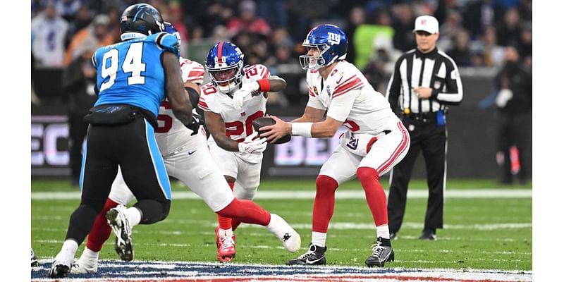 Referee announces penalty in German to Munich crowd during Giants-Panthers game