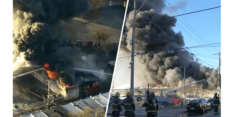 Live: Thick black smoke rises from Philadelphia warehouse inferno