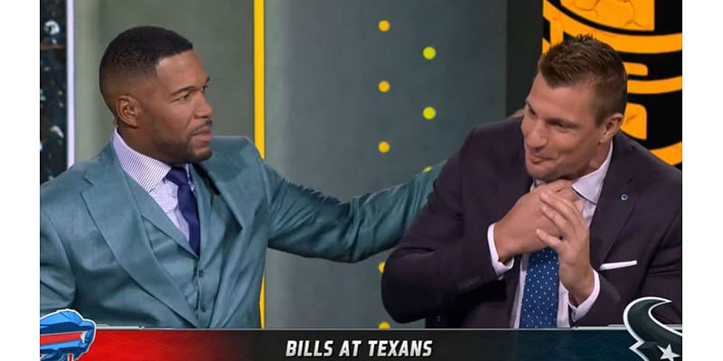 Michael Strahan slaps 'choking' Rob Gronkowski on the back as Fox NFL Sunday star struggles to get sentence out