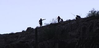 As extreme heat persists, hikers take to the trails during the evening hours