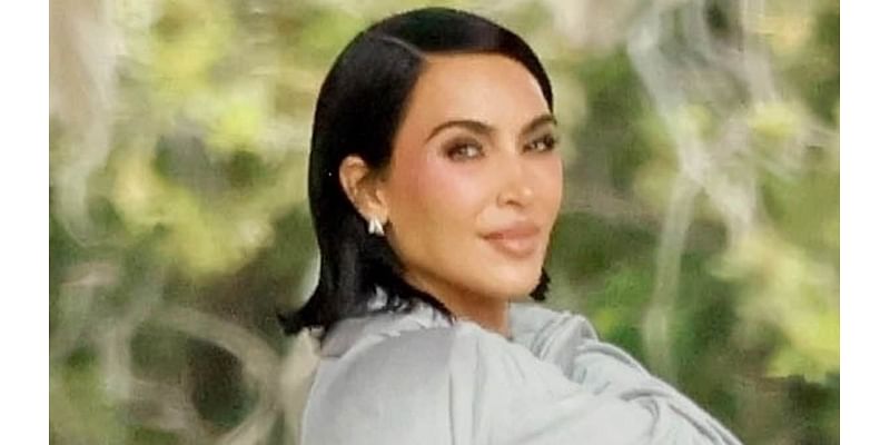 Kim Kardashian strolls through All's Fair set in flowy robe that shows off pert posterior