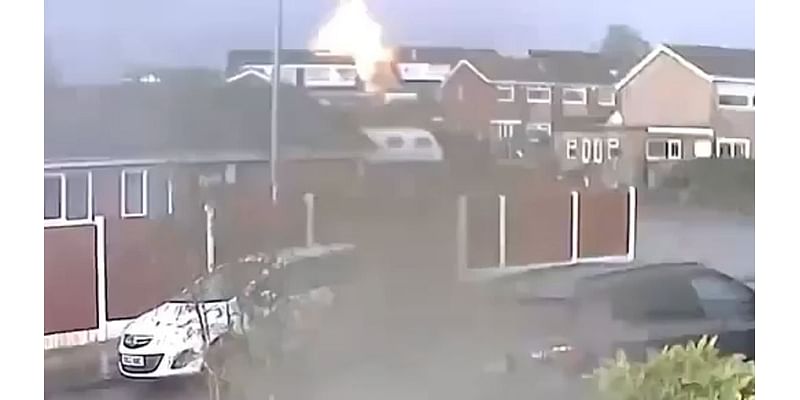 Shocking moment lightning strikes home and sparks 'explosion' - as neighbours are forced to evacuate