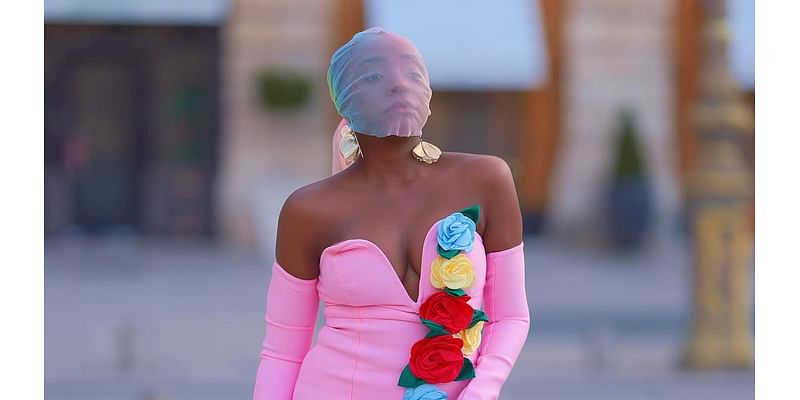 Suzan Mutesi puts the 'fake influencer' drama behind her as she commands attention at Paris Fashion Week in bizarre face covering