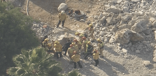 Firefighters attempt to rescue woman stuck in tunnel in Westlake