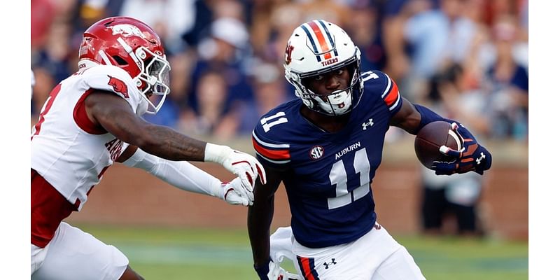 Which Auburn players had the highest and lowest Pro Football Focus grades against Arkansas?