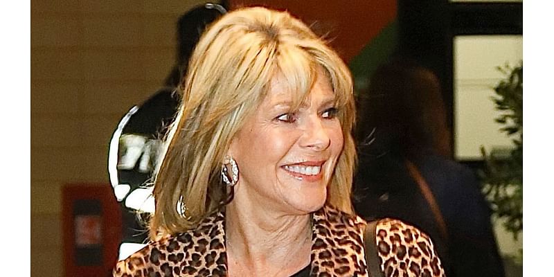 Ruth Langsford looks glamorous in leopard print on night out as her estranged husband Eamonn Holmes moves on with Katie Alexander - but her wedding ring is still firmly on