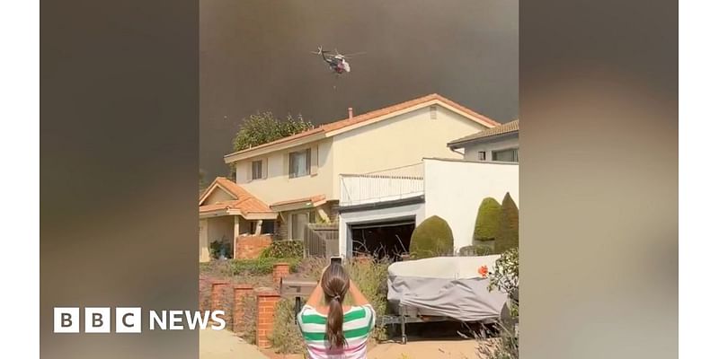 Smoke towers over homes as wildfire spreads near Los Angeles