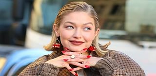 Gigi Hadid turns heads in a red rugby shirt and a trendy bomber jacket as she films glamorous Maybelline advert in the street in New York City