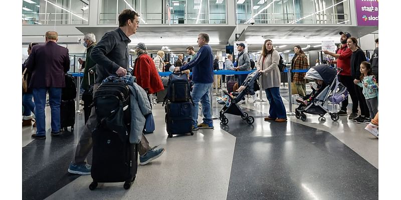 Rain, snow and wind spark Thanksgiving travel troubles on airports' busiest day of year