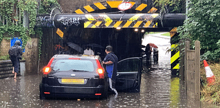 Motorist rescued from car stuck in floodwater