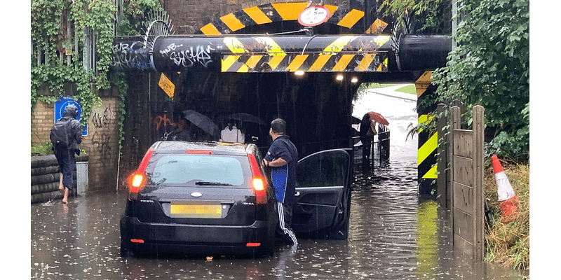 Motorist rescued from car stuck in floodwater