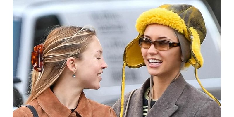 Nepo babies unite as Iris Law wraps up in a quirky yellow winter hat to hit the shops with stylish pal Lila Moss in New York City