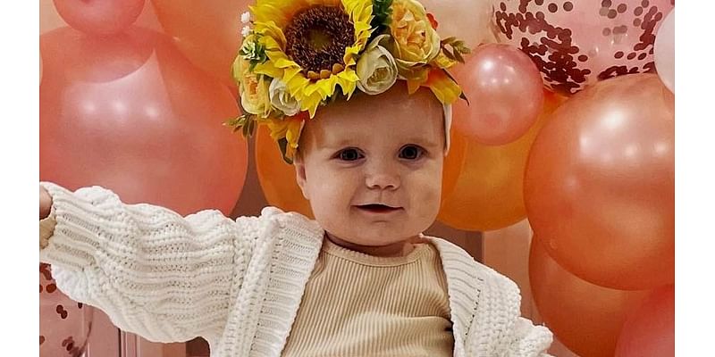 At first glance little Lola looks just like any other smiley, happy baby. But a subtle warning sign in this photo pointed to a devastating diagnosis - and it was too late to save her