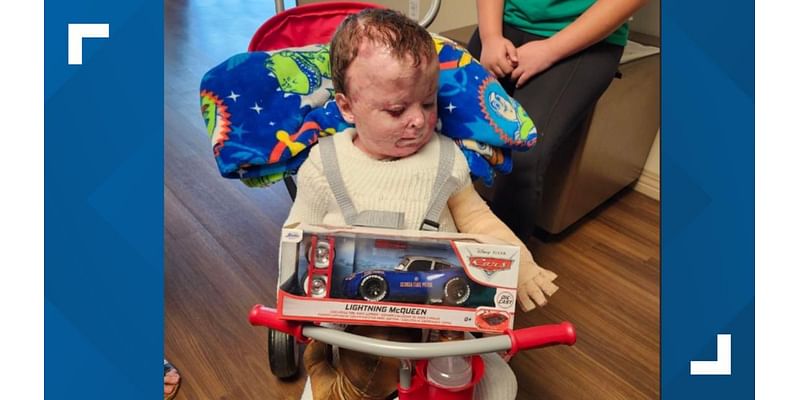 After saving life of 3-year-old burned by father, troopers bring toys and support as he leaves hospital