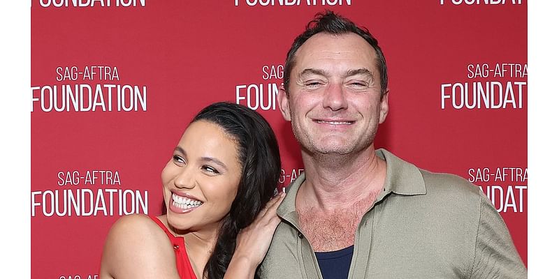 Jude Law can't contain his laughter as he reunites with glam co-star Jurnee Smollett on stage at the SAG-AFTRA Foundation ahead of the release of their new movie The Order