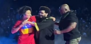 Security rush on stage as The Weeknd is grabbed by concertgoer during Melbourne show