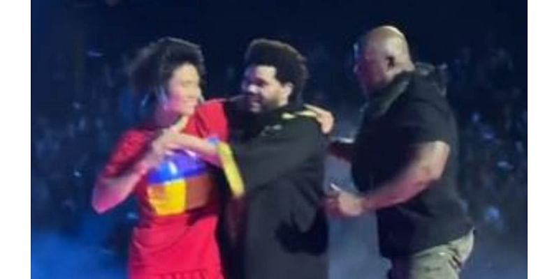 Security rush on stage as The Weeknd is grabbed by concertgoer during Melbourne show