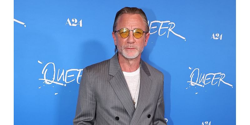 Daniel Craig, 56, is a silver fox in grey Loewe suit at Queer premiere in LA