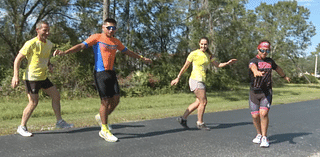 Special Olympic best friends train together for first Half Ironman