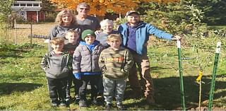 Prell family plants apple trees at Hawthorn Hollow