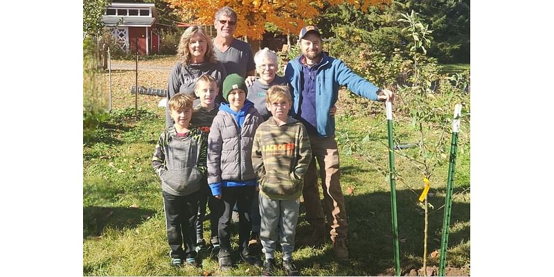 Prell family plants apple trees at Hawthorn Hollow