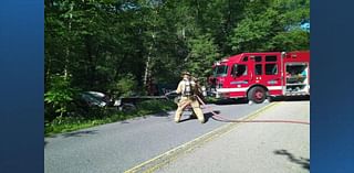 Driver entrapped after cement truck rolls off the road in Holliston