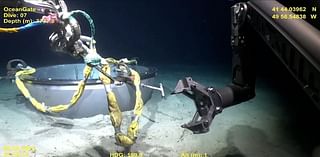 New video showing deep-sea salvage of Titan sub is released as OceanGate employee hits back at accusations there was a 'desperation' to complete dives in doomed vessel