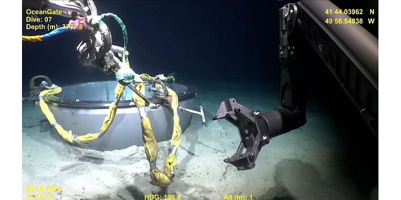 New video showing deep-sea salvage of Titan sub is released as OceanGate employee hits back at accusations there was a 'desperation' to complete dives in doomed vessel