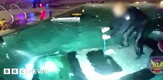 Moment police officer rescues man trapped in submerged car